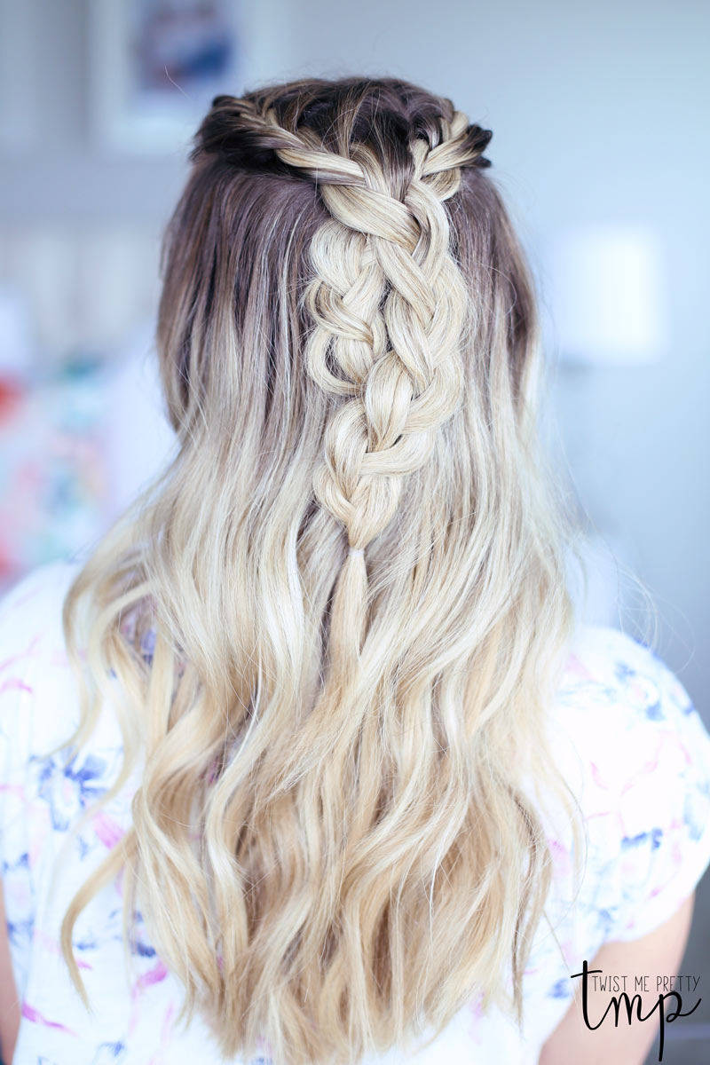 Abby wears a braided top-knot down.