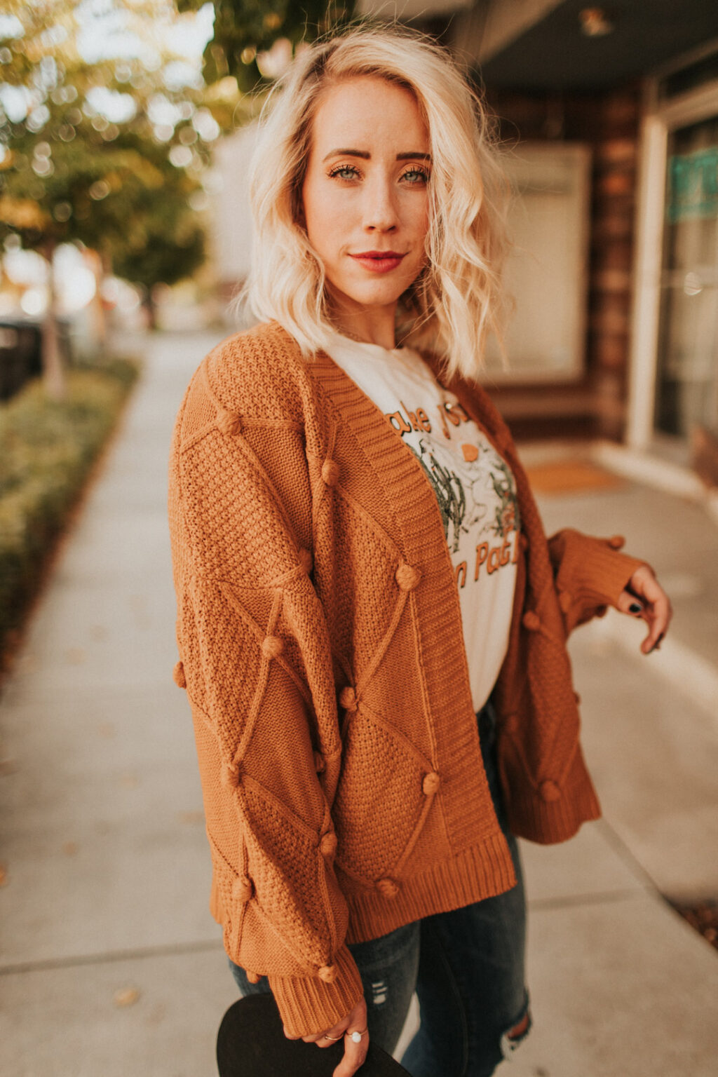 Love this sweater with the pom pom detail. Such warm tones perfect for fall and winter and anytime you need to be cozy!